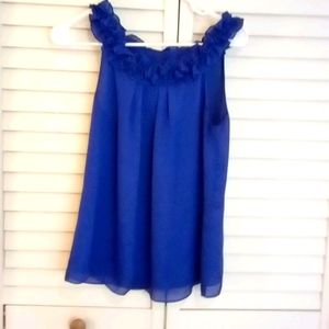 Limited ruffled neck, sleeveless blouse.